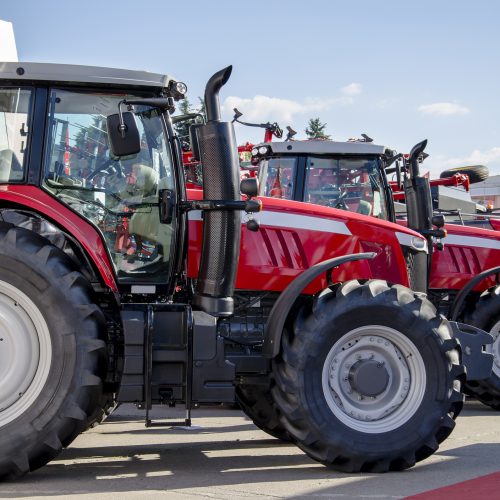 Red large tractor, machine for sowing, preparation and cultivation of soil for farmers